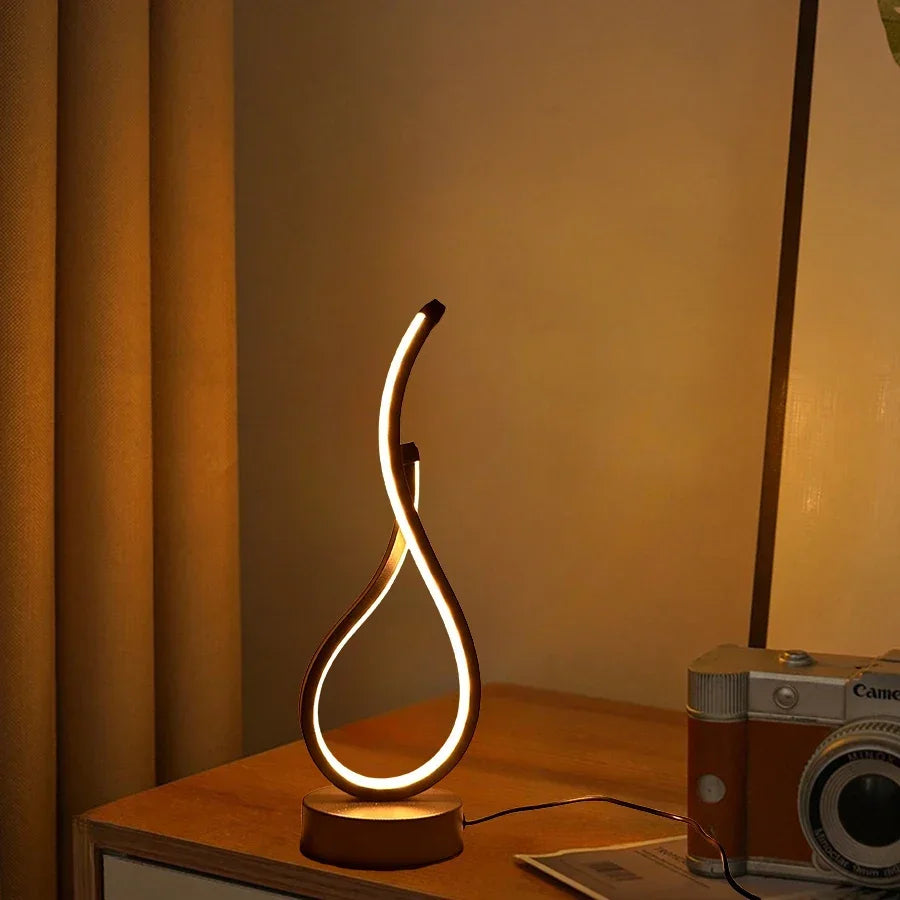 A modern wrought iron table lamp powered by USB - three tone light